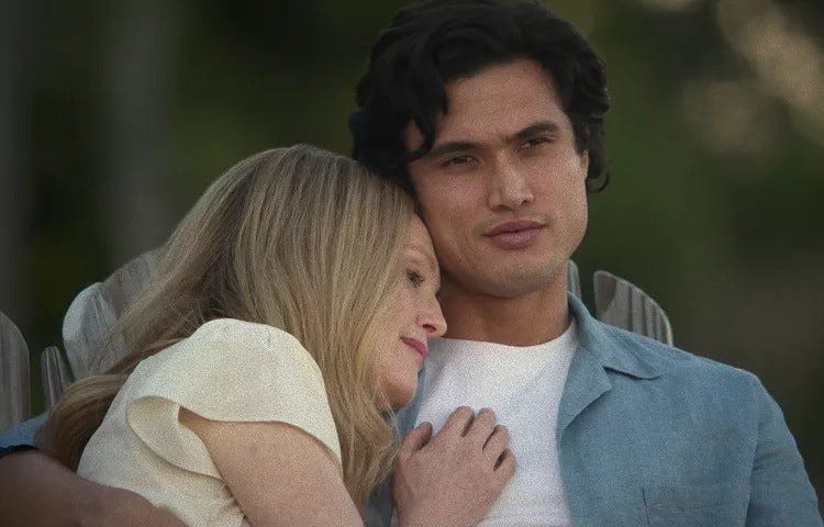 A scene from the movie May December where Charles Melton’s Joe Yoo is hugging Gracie, played by Julianne Moore.