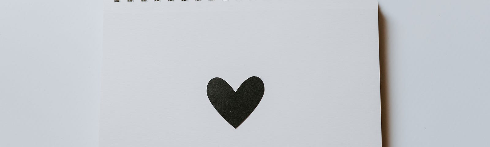 notepad with a heart in the center of it