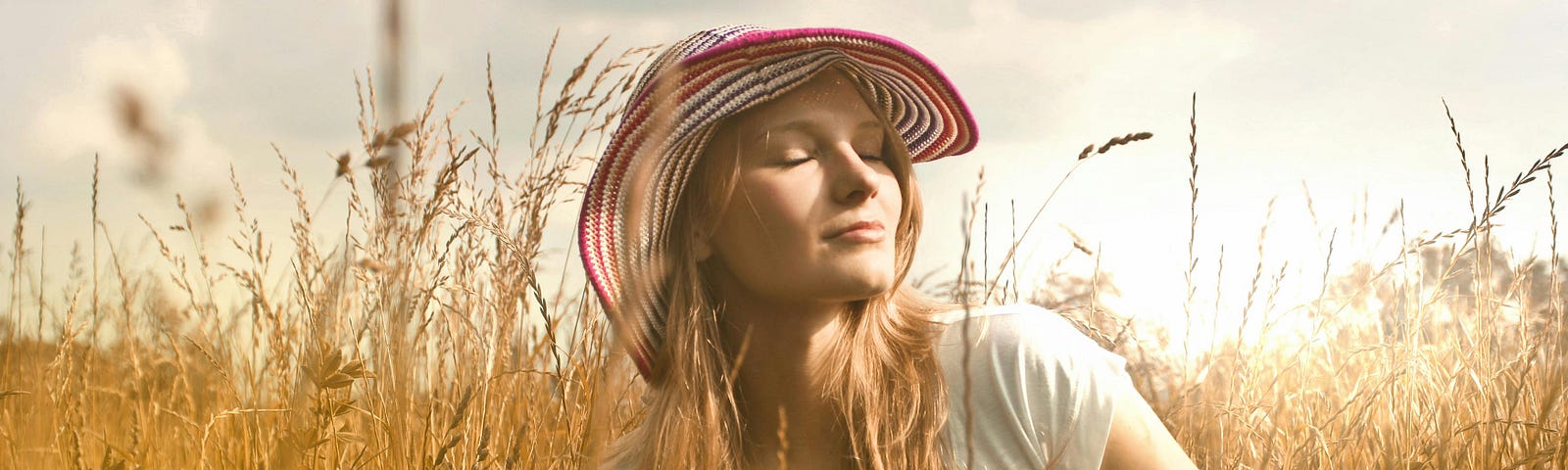 Woman Wearing White Top and Red and White Sunny Hat