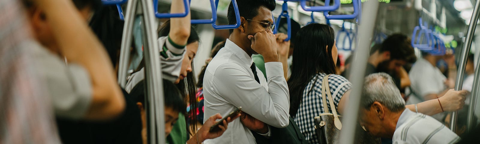 A man standing in the subway.