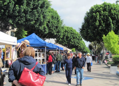 Photo of Uptown Whittier Farmer’s Market, with the trees cascading down.