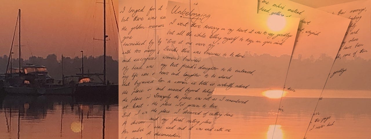 A handwritten poem entitled Unbelonging by Carolyn Hastings set against orange sunrise & tall masted boats moored at a jetty.