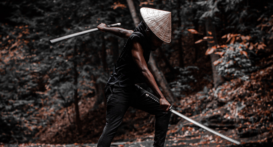 A sword fighter in a forest