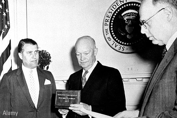 Rocket scientist Wernher von Braun (left), a former Nazi, receives a federal civilian service award from President Dwight D. Eisenhower circa 1959.