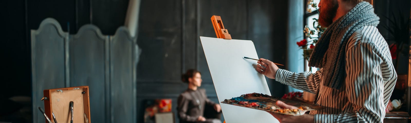 The artist painting a portrait of a  female client.