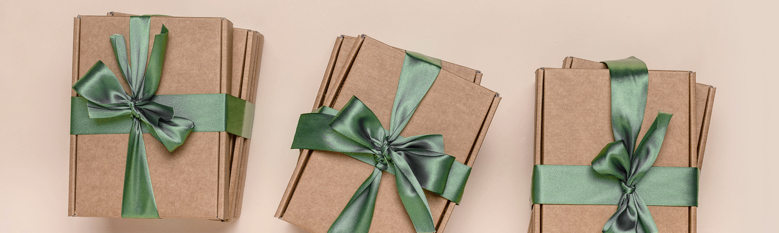 Curology skin care boxes wrapped in festive green bows