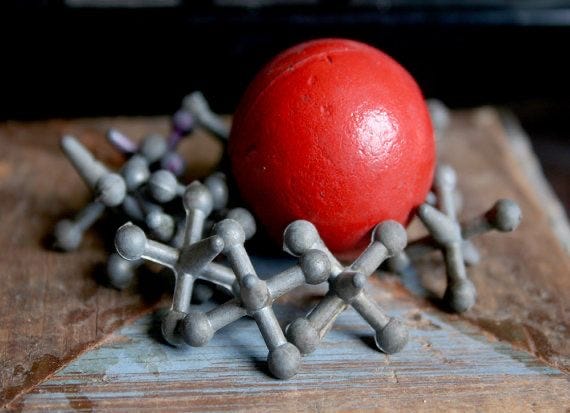 Jacks — red ball and tacks (childhood toy in 1970's)