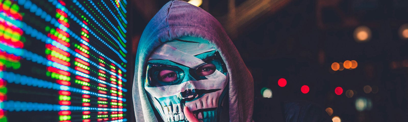 Man wearing scary mask with overly large teeth