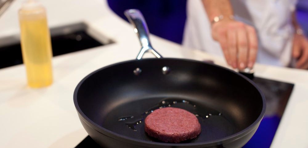 Cooking world’s first beef burger patty.