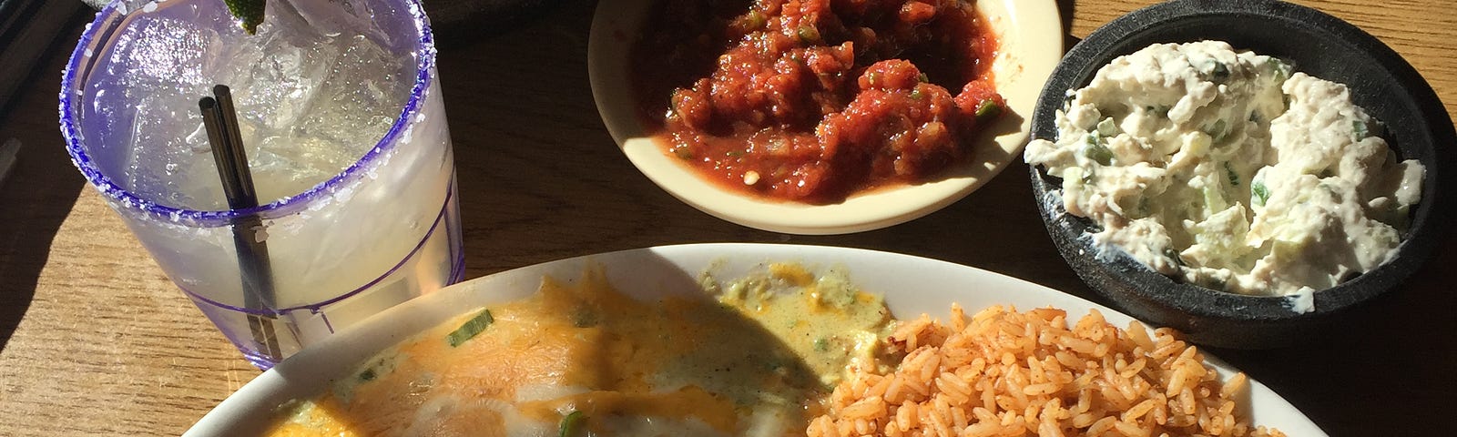 El Azteco Enchiladas Jocoque and the beloved cheese dip and home made salsa. Photo by Joseph Serwach