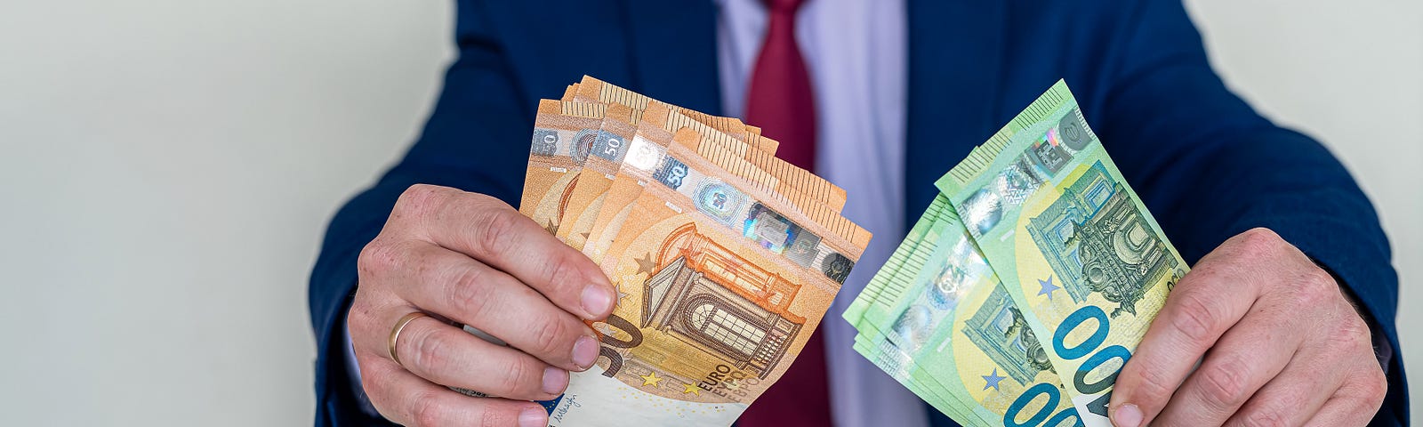 business-man-holding-euro-bills-office-bank-saving-money-withdrawal-banking-deposit-salary-bribe — Un Swede