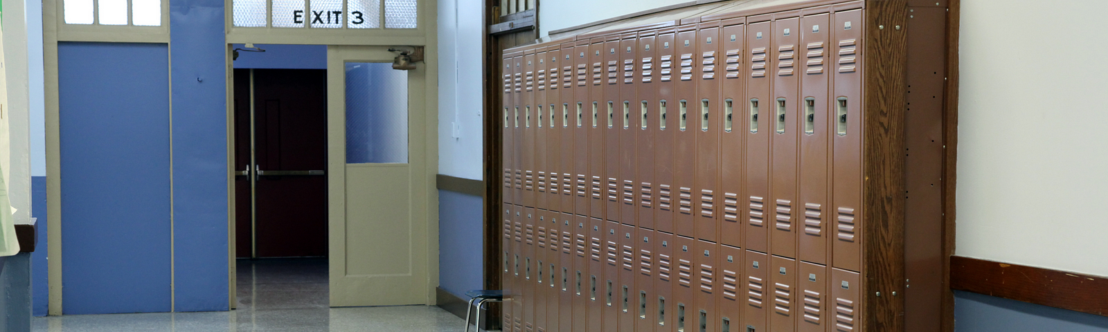 A school hallway with a row of lockers