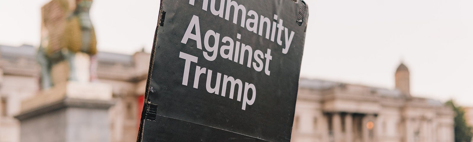 Sign that says “Humanity Against Trump.”