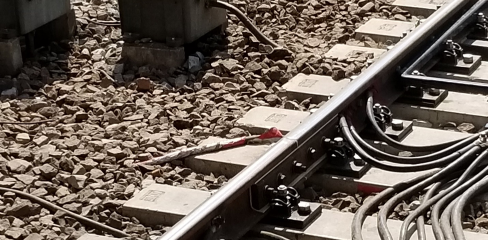 Electric “joints” of jointless track circuits on Shanghai Metro. Author Antigng, This file is licensed under the Creative Commons Attribution-Share Alike 4.0 International license. File: A local variant of the GRS Wee-Z Bond at Jinjiang Park Station.jpg — Wikimedia Commons