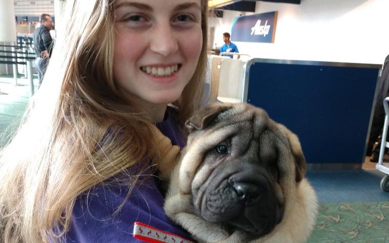 Hannah, my granddaughter and Sir Riley at the Portland Airport