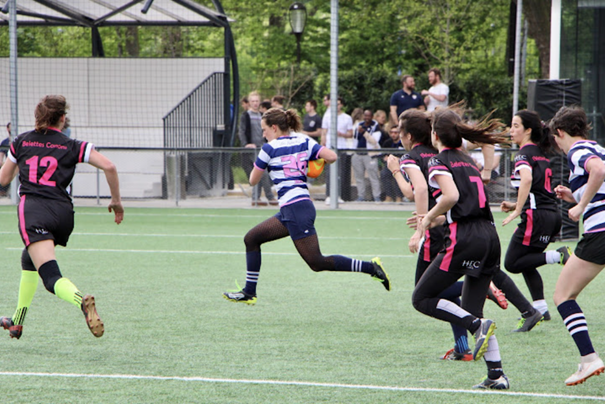 Amateur feminine athletes playing rugby