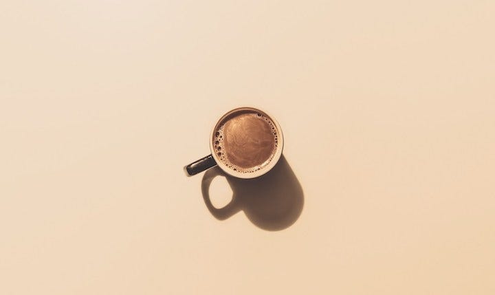 A photo of a very small cup of coffee to introduce Starbucks’ new and budget-friendly, one-sip Migrant Mini-Mochas. Satire. Funny. Immigration. Mexico. New York City.