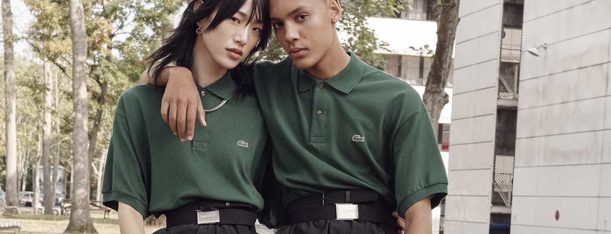 Two models pose for Lacoste’s unisex campaign.