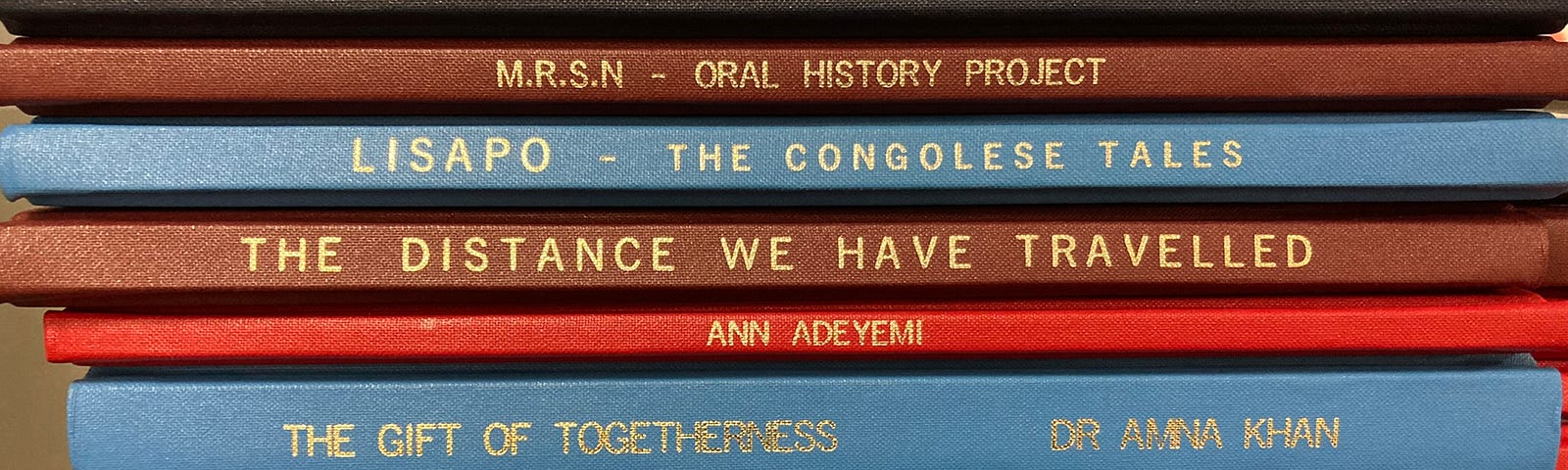 Bound volumes on a library shelf