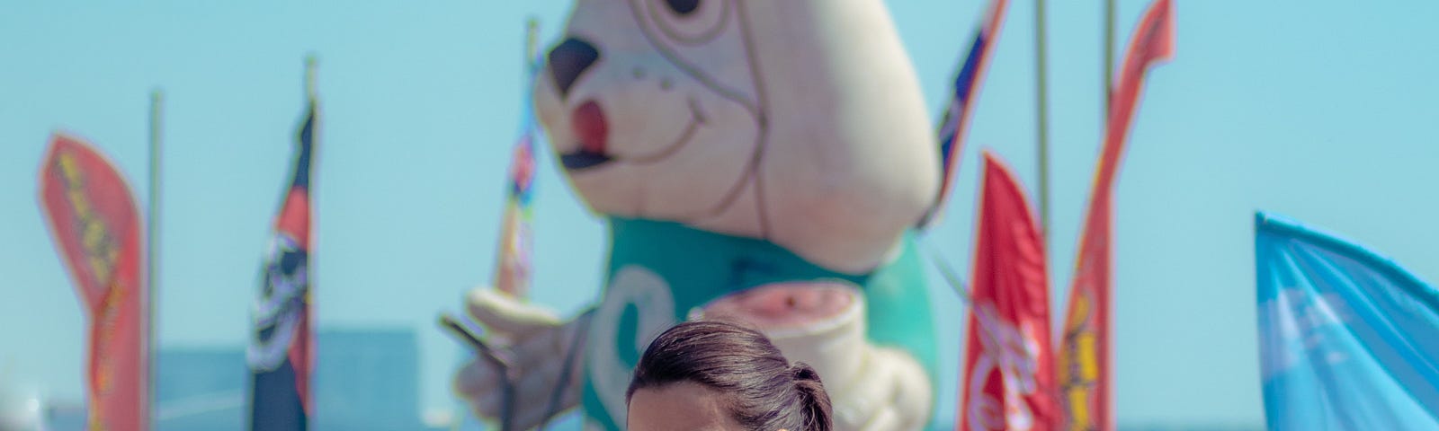 A young, brunette woman turn to look at the camrea. the caption read’s “Jeff loved crazy golf. Sadly he was shit at it” (Image: Unsplash)