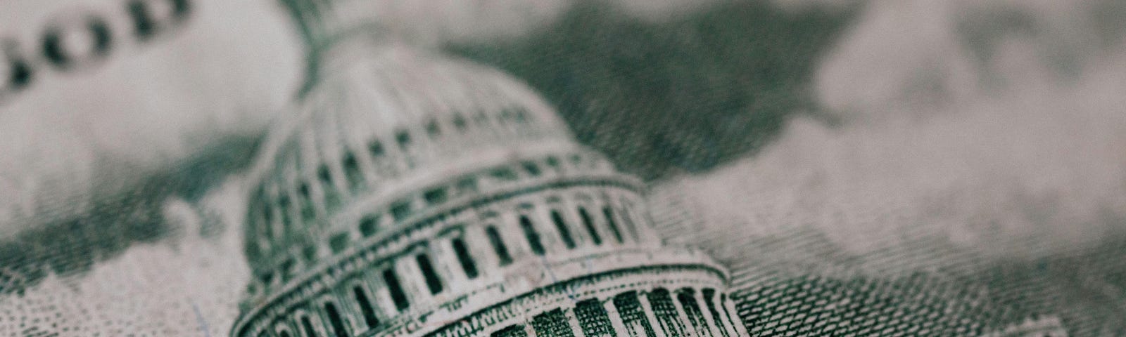 An etching of the Capitol on a banknote.