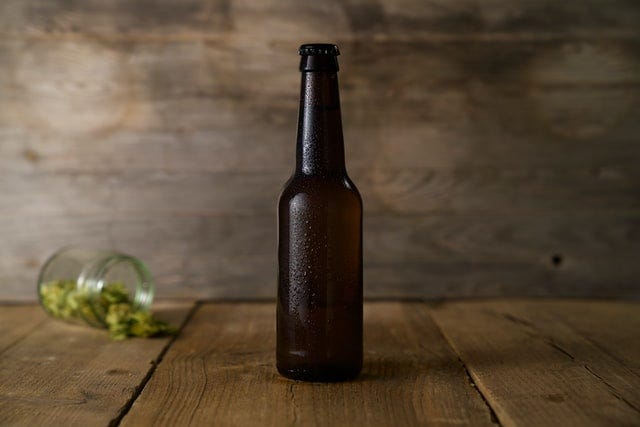 beer bottle on wooden surface