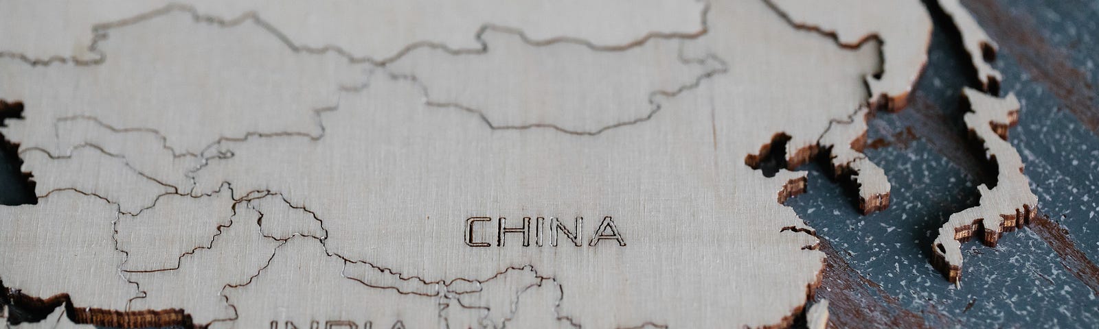 wooden map of Asia but only India and China are labeled