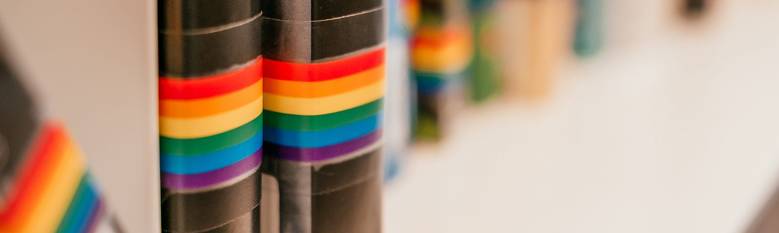 Shelf with LGBTQ awareness books at the public library. Photo by Christina Vartanova from Shutterstock.