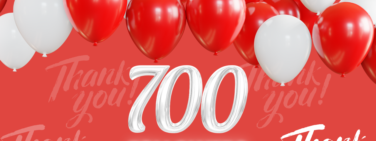 Red and white image. Red background. Red and white ballons. In white, the number 700 and the word followers.