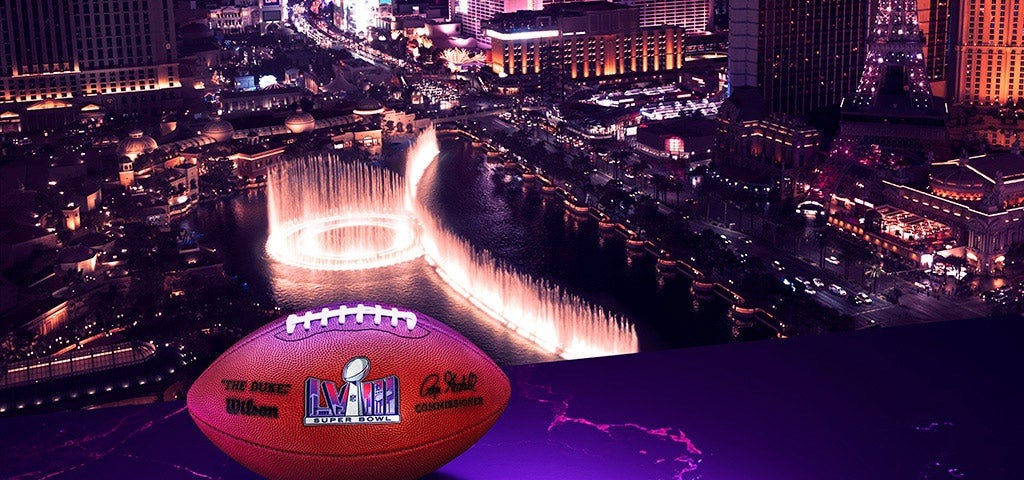 A huge football sits by the Las Vegas Strip at night
