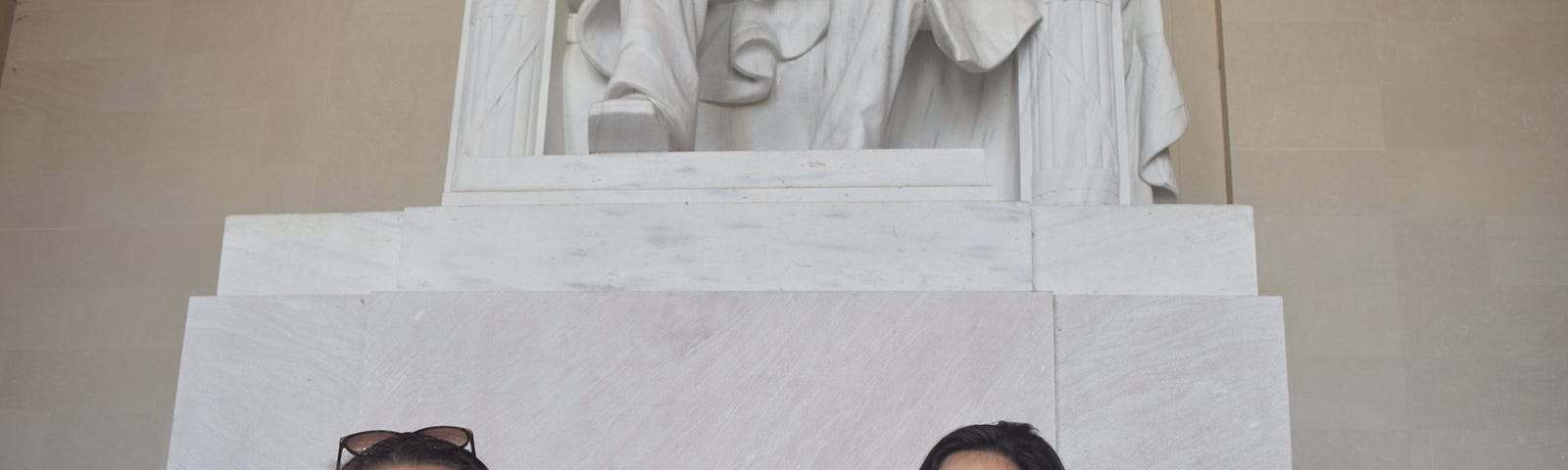 Three students posing in front of Lincoln Memorial