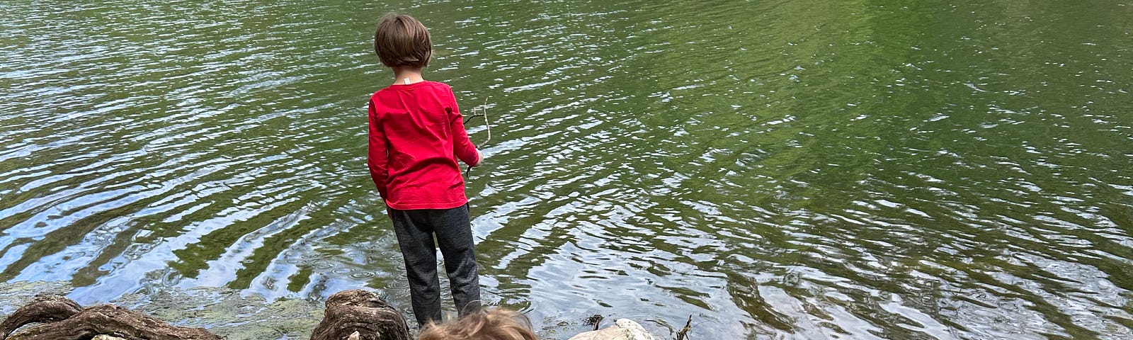 Image of two children at a river.