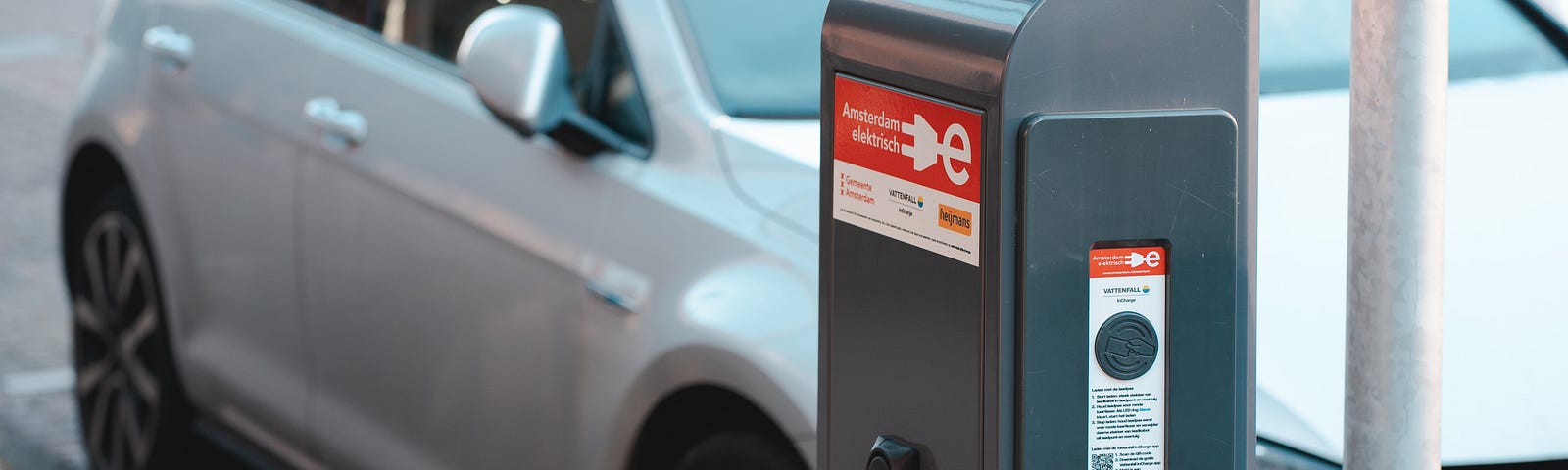 An EV charging in the street. Photo by Ernest Ojeh on Unsplash