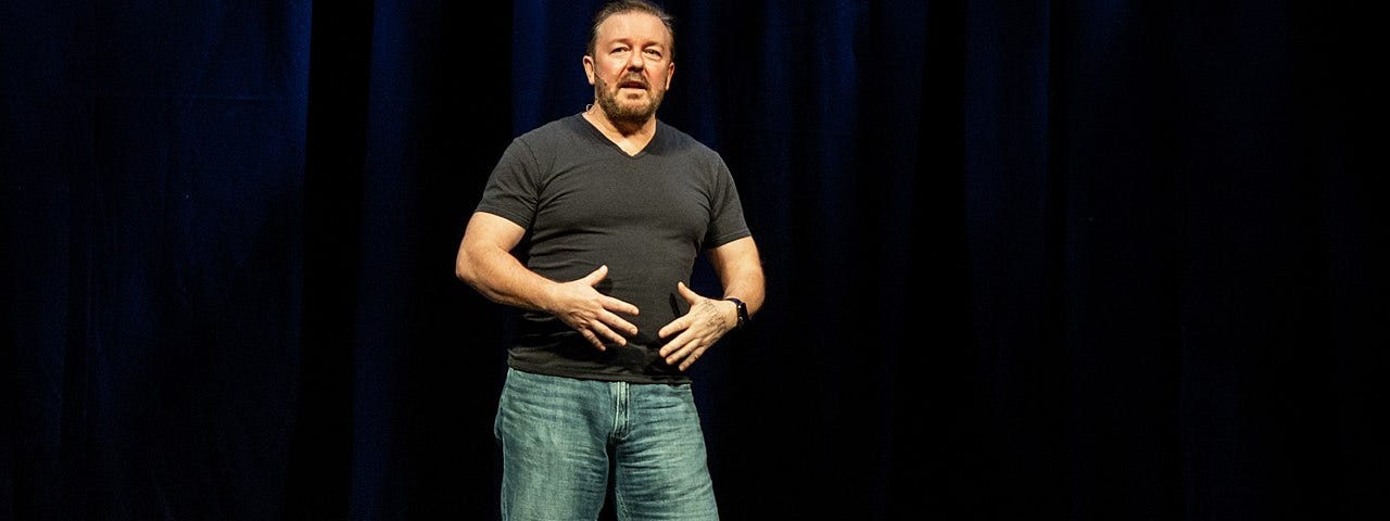 Ricky Gervais does stand up. Gervais is funny as fuck!
