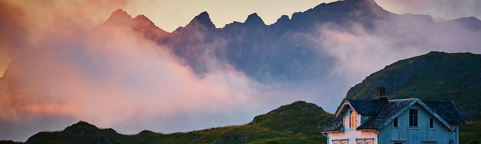 House in Norway wreathed in mists and twilight