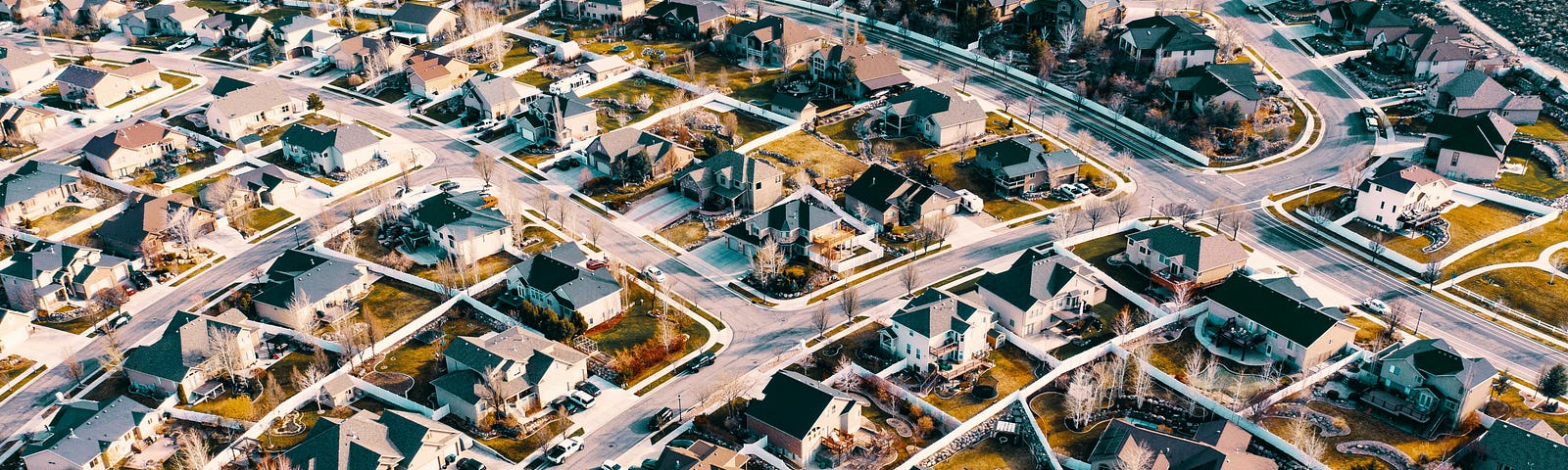 Air shot of North American suburbs, all of the houses very similar to one another