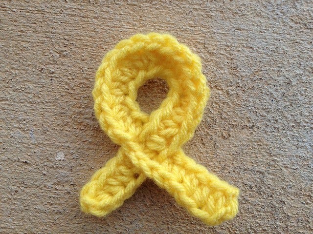 A crochet cancer awareness ribbon