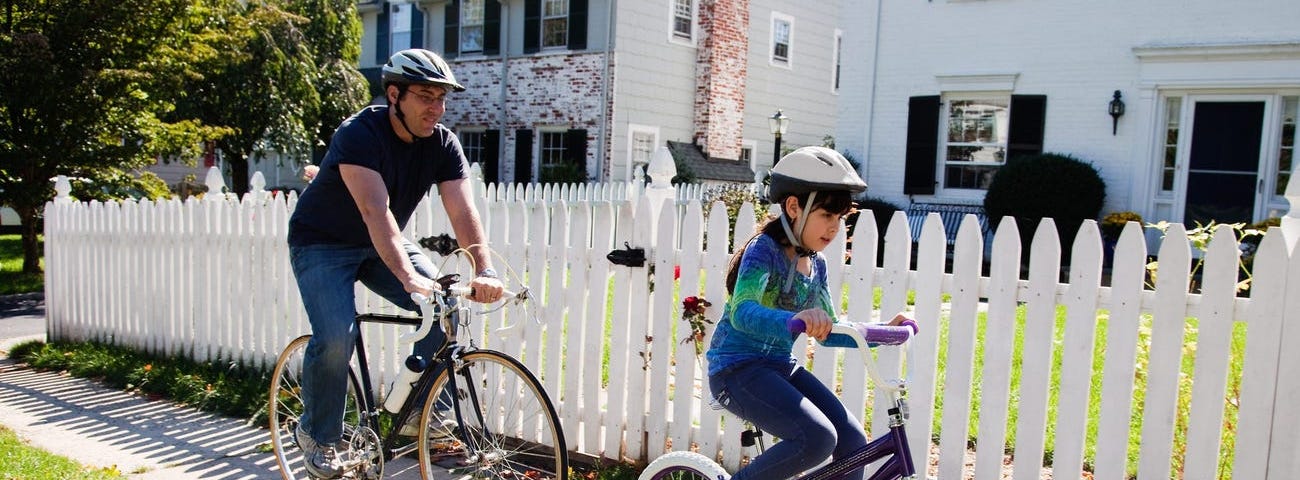 Individuals riding bikes.