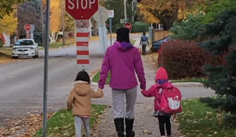 Mom and kids walking to school