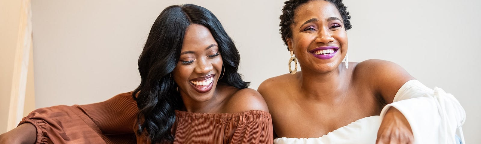 Two black women laughing together