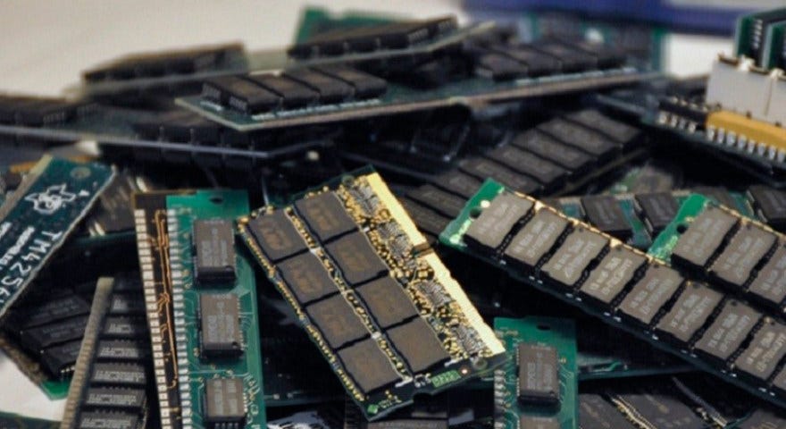 A pile of RAM sticks on a table