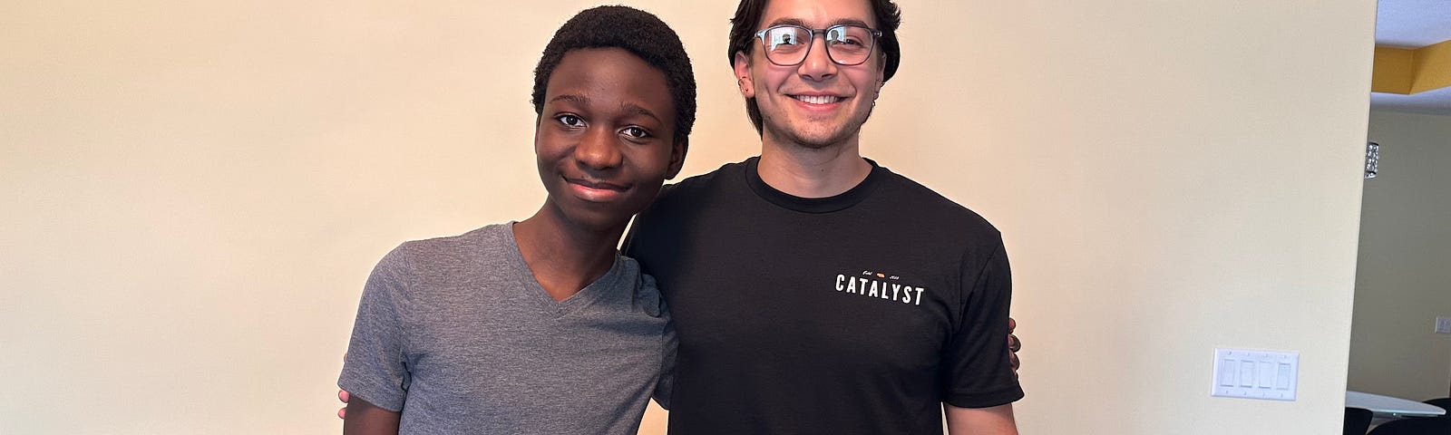 Brandon (right) and Jeffrey, his mentee, smile for a photo
