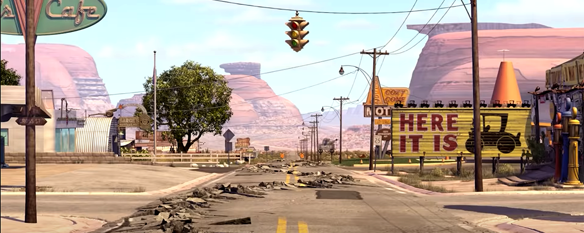 A screenshot of the damage pavement of the main road of Radiator Springs from Pixar’s movie Cars from 2006.