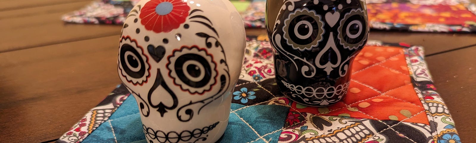 This shows sugar skull salt and pepper shakers.