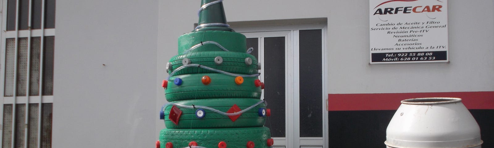 A Christmas tree made out of old tyres and a traffic cone, from a local garage