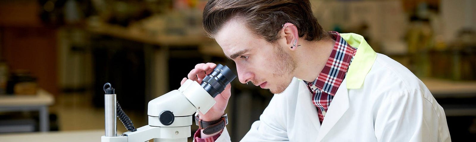 Gerard looking through a microscope