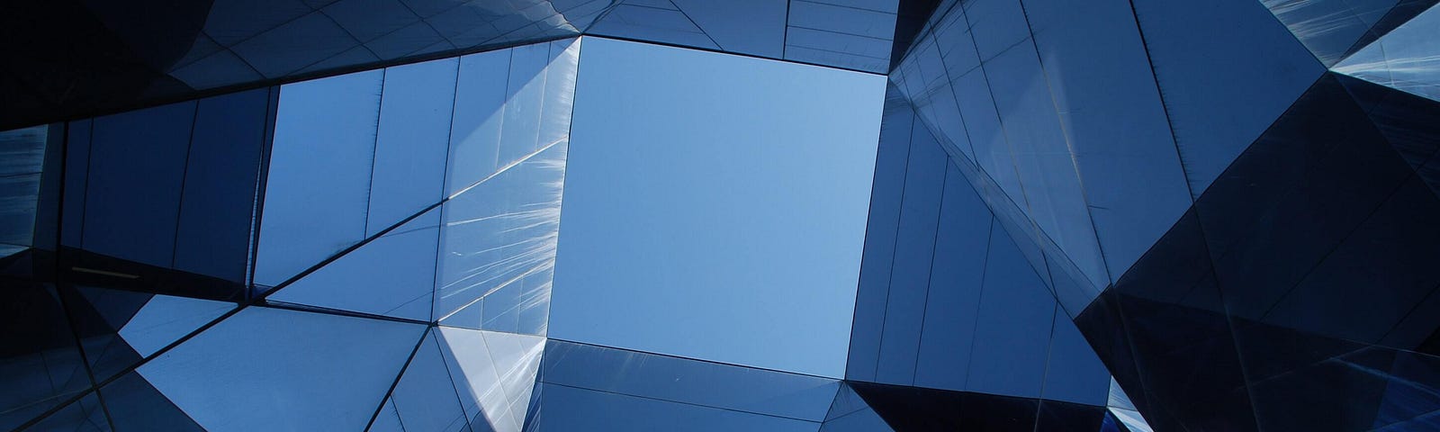 Looking up at tall towering buildings