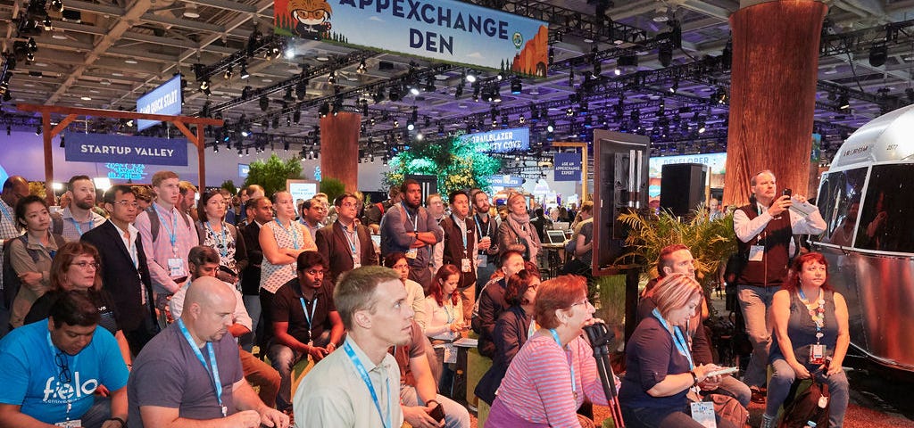 A large crowd gathers in the AppExchange Den at a past Dreamforce event.