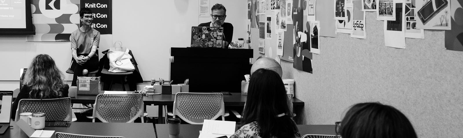 Black and white photo of a conference room full of Design System Day participants