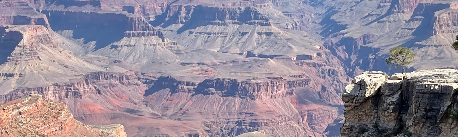 the Grand Canyon with blue sky and clouds